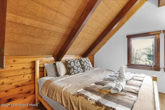 a view of a two chairs in the balcony