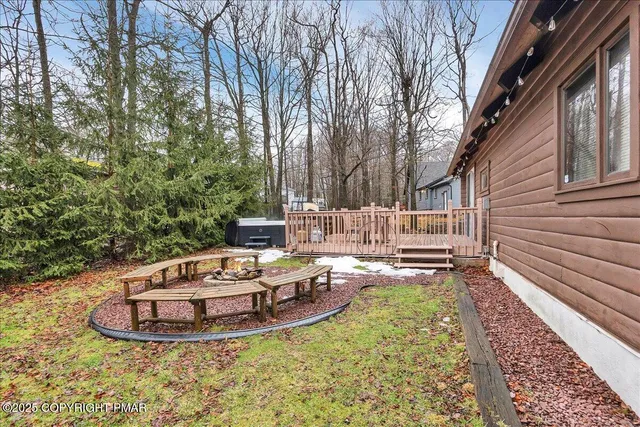 a view of a backyard with sitting area