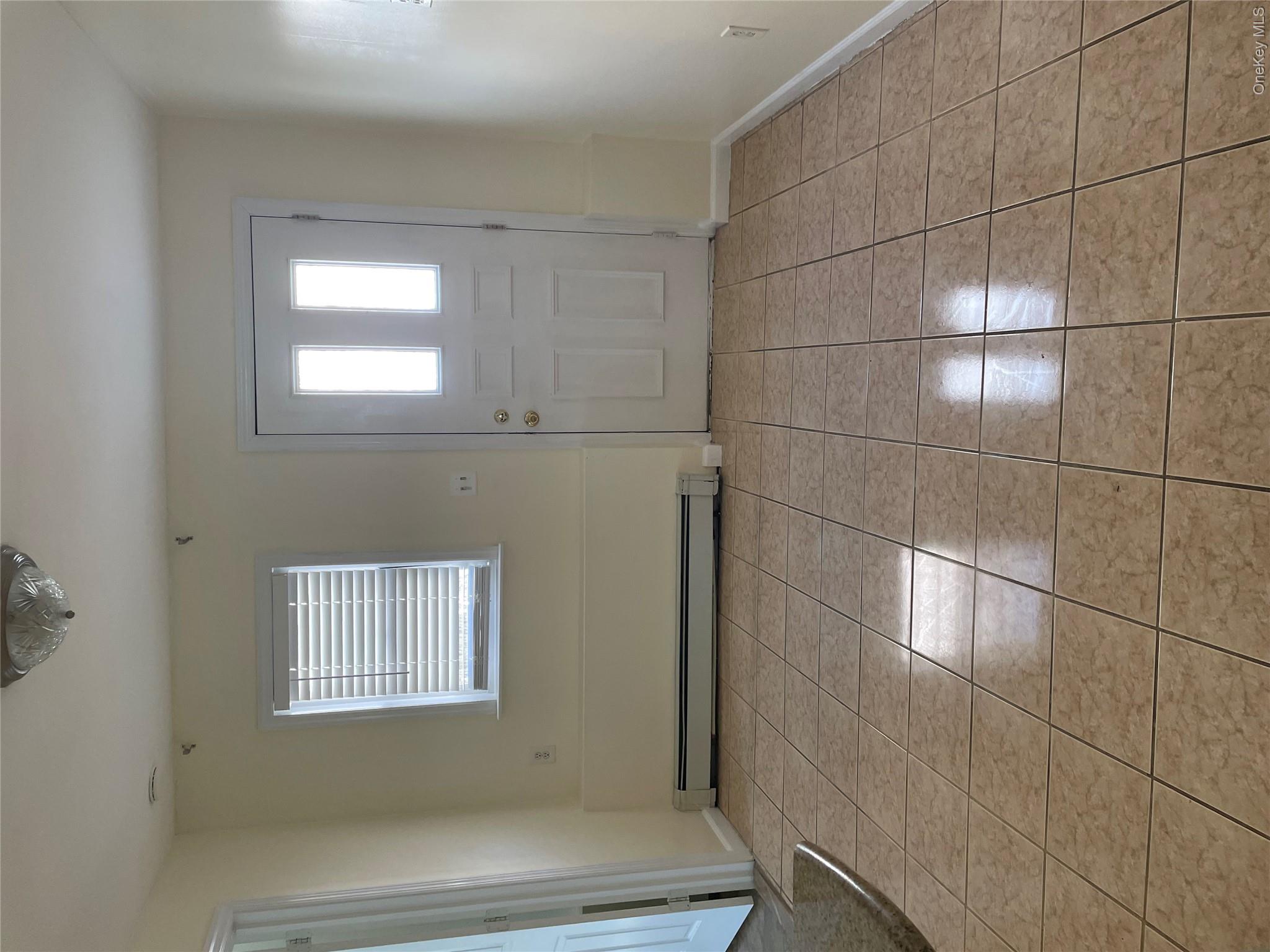 554 Long Beach Road Island Park, NY 11558 - Photo 2 of 10 Entry Into Living Room