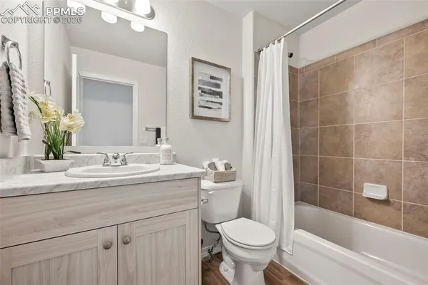 a bathroom with a sink a toilet and a bathtub