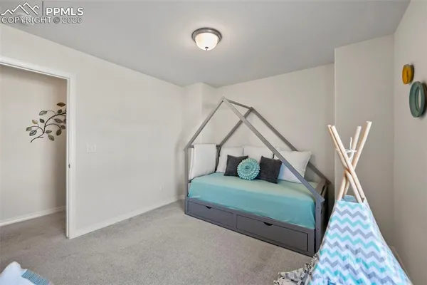 a bedroom with bed and a window