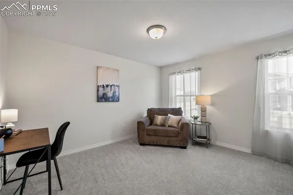 a livingroom with furniture and a window