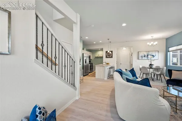 a living room with furniture and a table