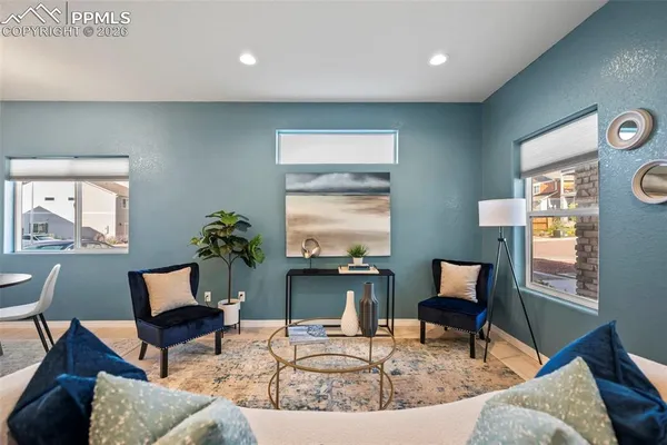 a living room with furniture and a window