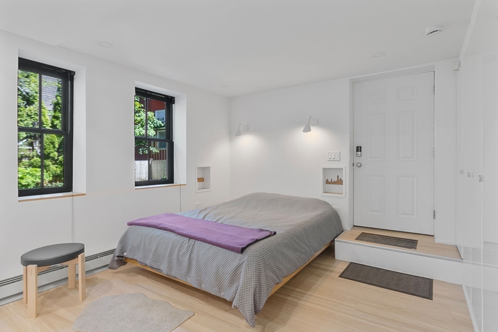 99 Upland Road Cambridge, MA 02140 - Photo 3 of 16 a bedroom with a bed and a chair