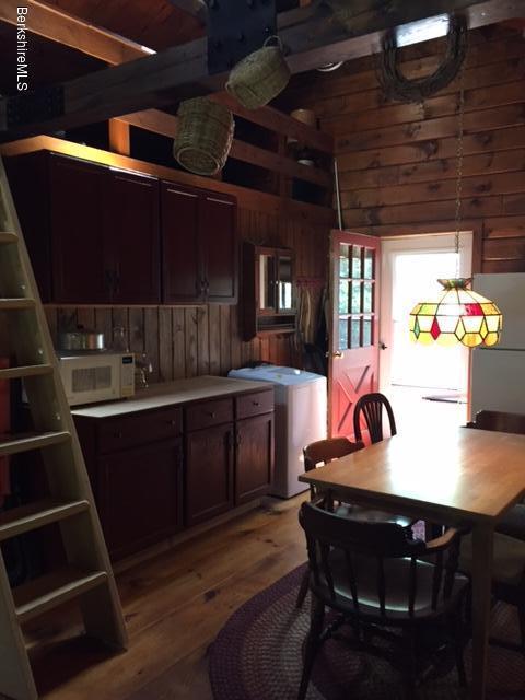 86 Peterson Road Becket, MA 01223 - Photo 17 of 52 a kitchen with a sink cabinets and window