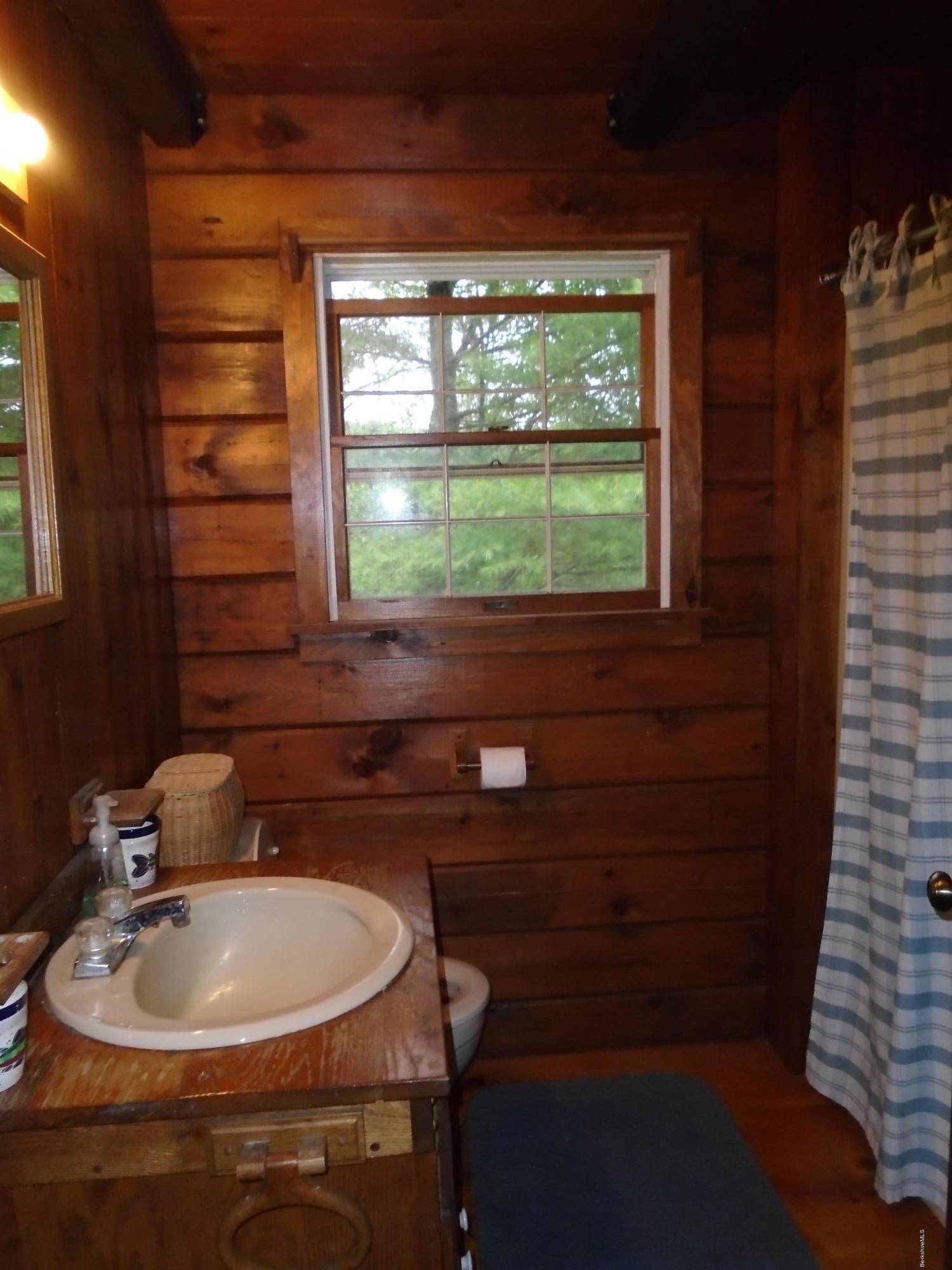 86 Peterson Road Becket, MA 01223 - Photo 21 of 52 a bathroom with a sink and a window