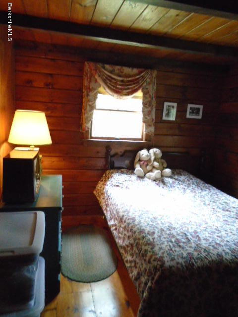86 Peterson Road Becket, MA 01223 - Photo 23 of 52 a bedroom with a bed and a window