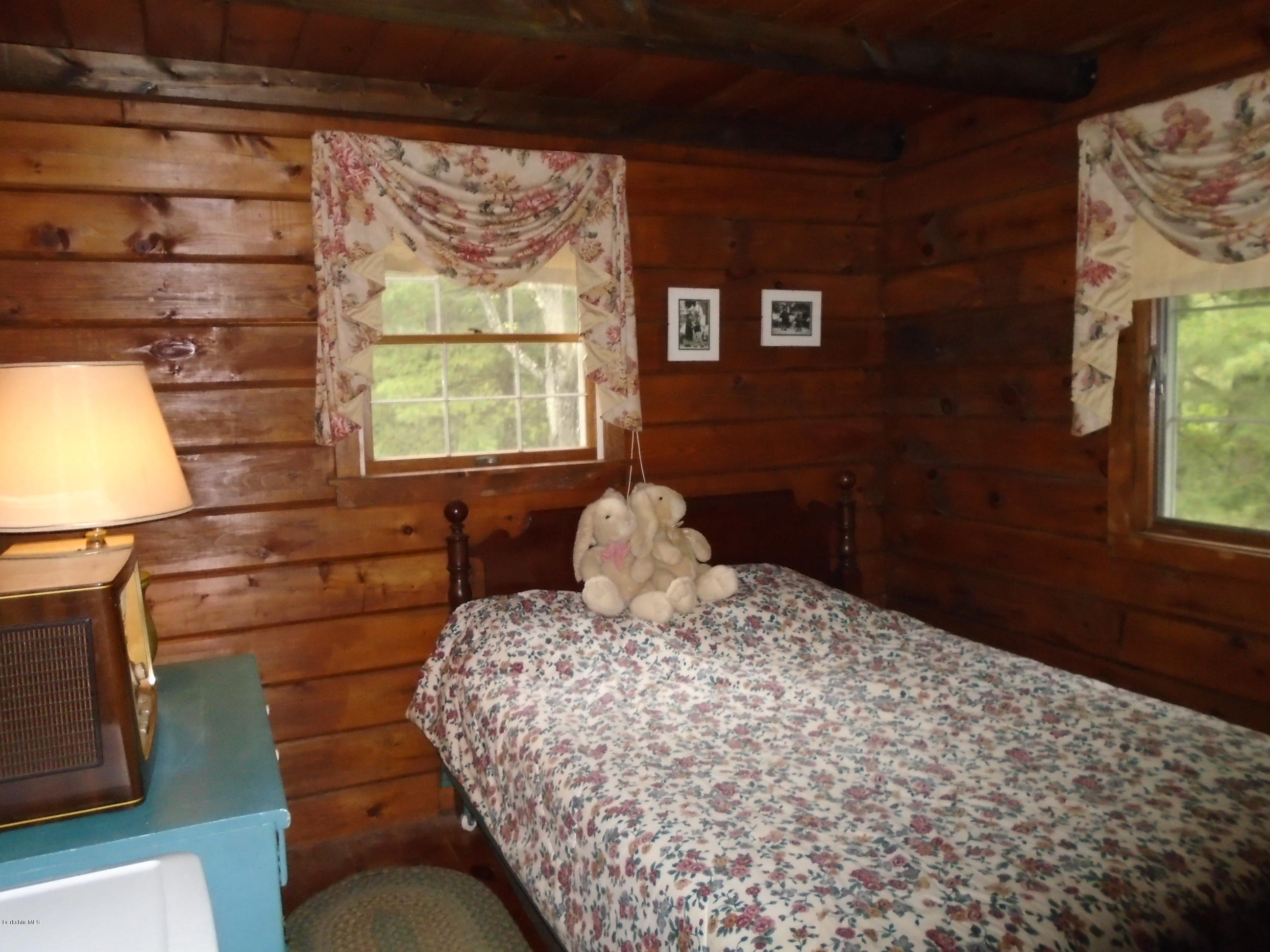 86 Peterson Road Becket, MA 01223 - Photo 24 of 52 a bedroom with a bed and a window