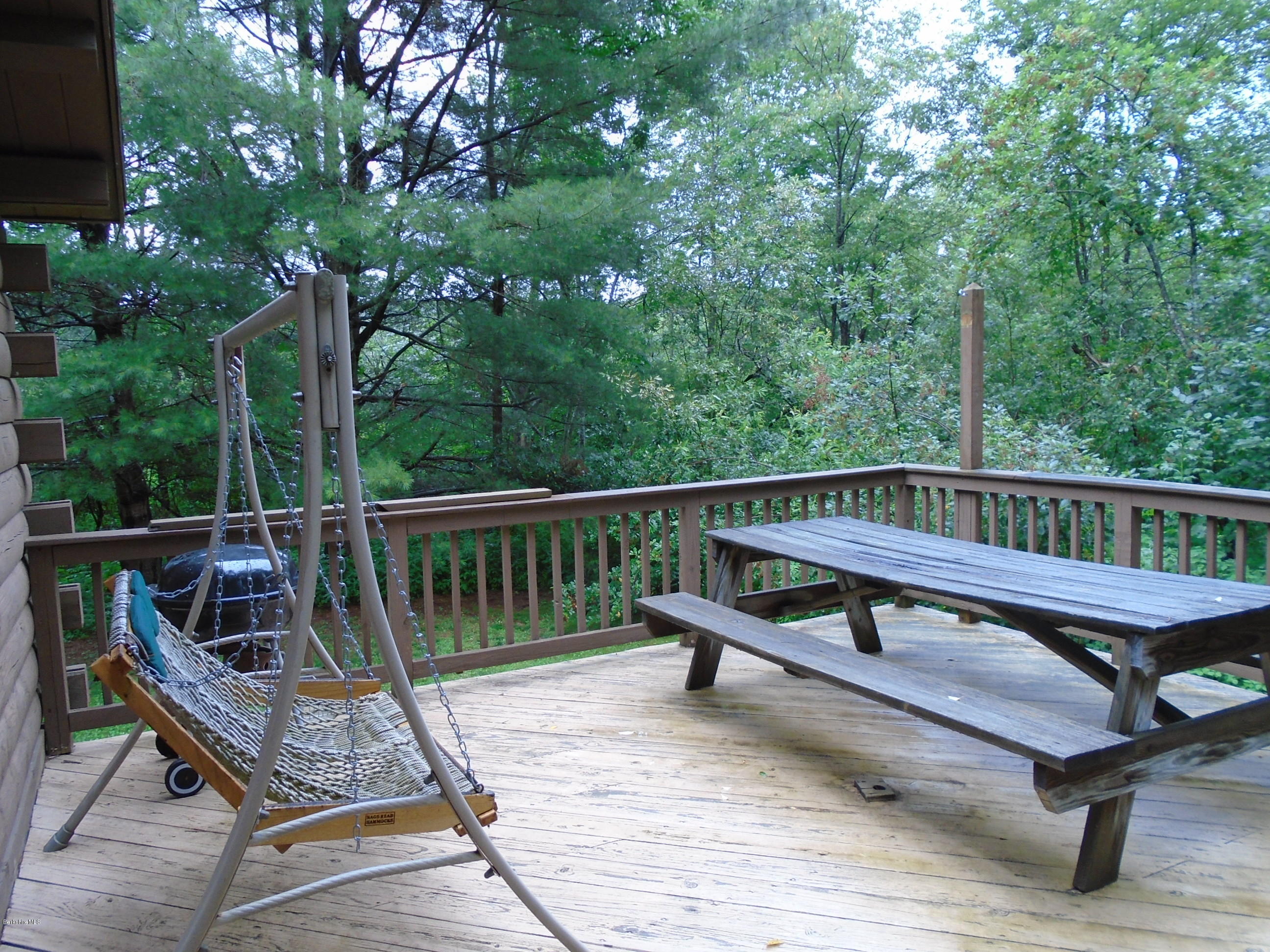 86 Peterson Road Becket, MA 01223 - Photo 34 of 52 a view of a wooden deck with furniture