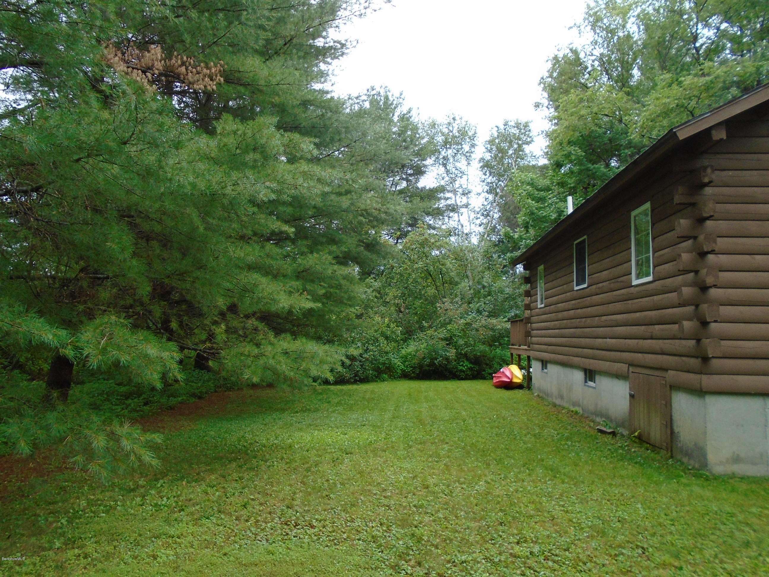 86 Peterson Road Becket, MA 01223 - Photo 41 of 52 a view of a backyard with a garden