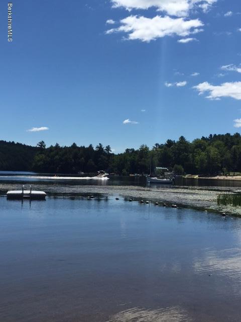 86 Peterson Road Becket, MA 01223 - Photo 45 of 52 a view of lake with trees in the background
