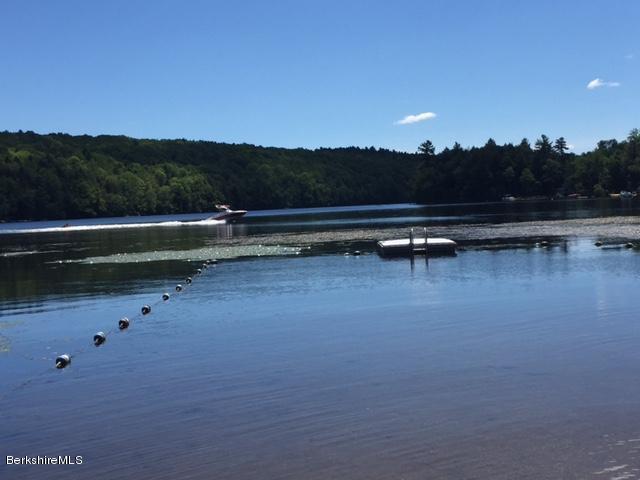 86 Peterson Road Becket, MA 01223 - Photo 47 of 52 a view of a lake with houses in back