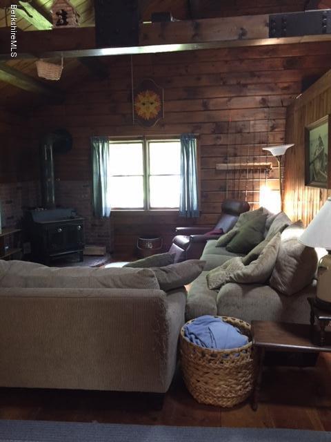 86 Peterson Road Becket, MA 01223 - Photo 7 of 52 a living room with furniture and a large window