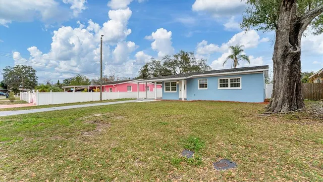 a view of a kitchen with a sink and a refrigerator
