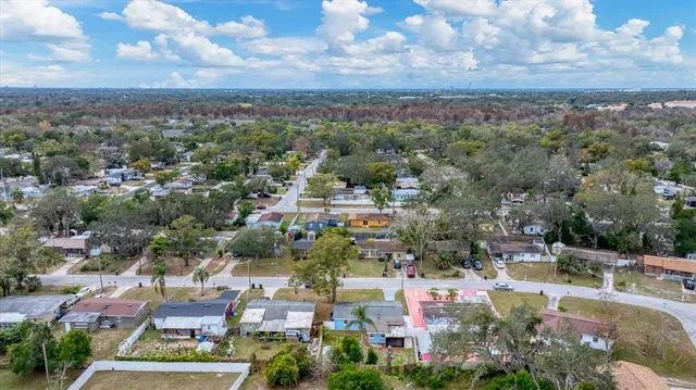 an aerial view of residential building and green space