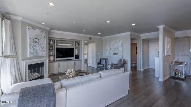 a large kitchen with a large counter top appliances and cabinets