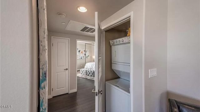 a bathroom with a granite countertop sink a mirror and a shower