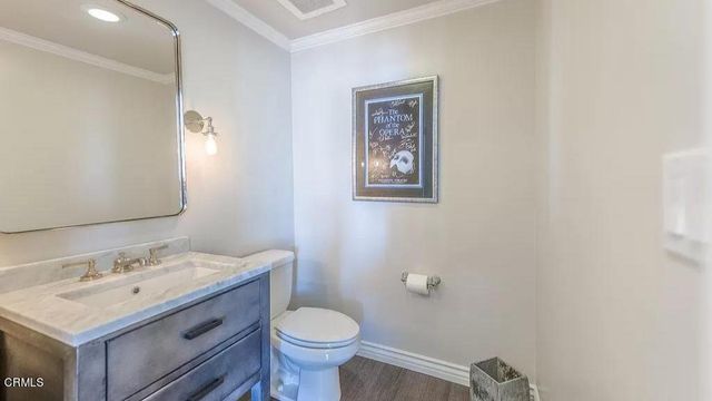 a bedroom with a bed and a mirror