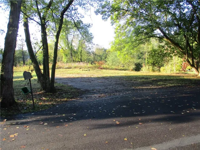 a view of a yard with an outdoor space