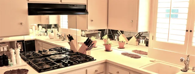 a bathroom with a sink mirror and toilet