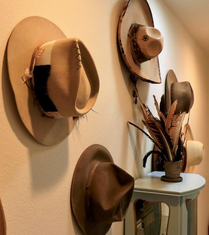 a bed with a white comforter and pillows