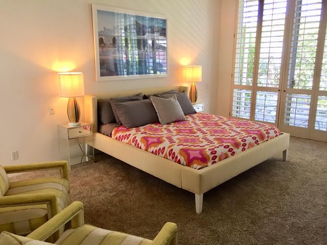 a bathroom with a sink and large mirror
