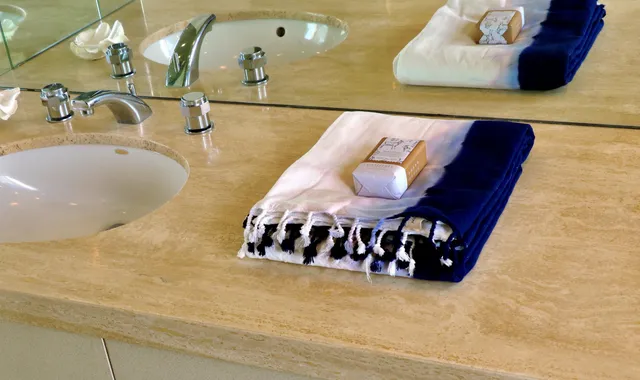 a view of walk in closet with clothes