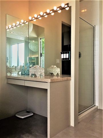 an outdoor sitting area with chairs and wooden floor