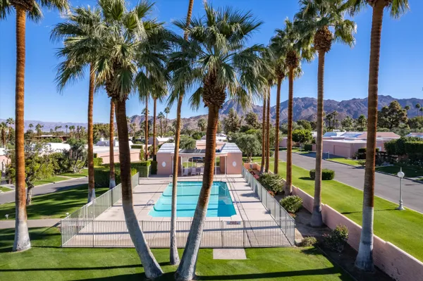 a outdoor space with patio lots of furniture and a chandelier