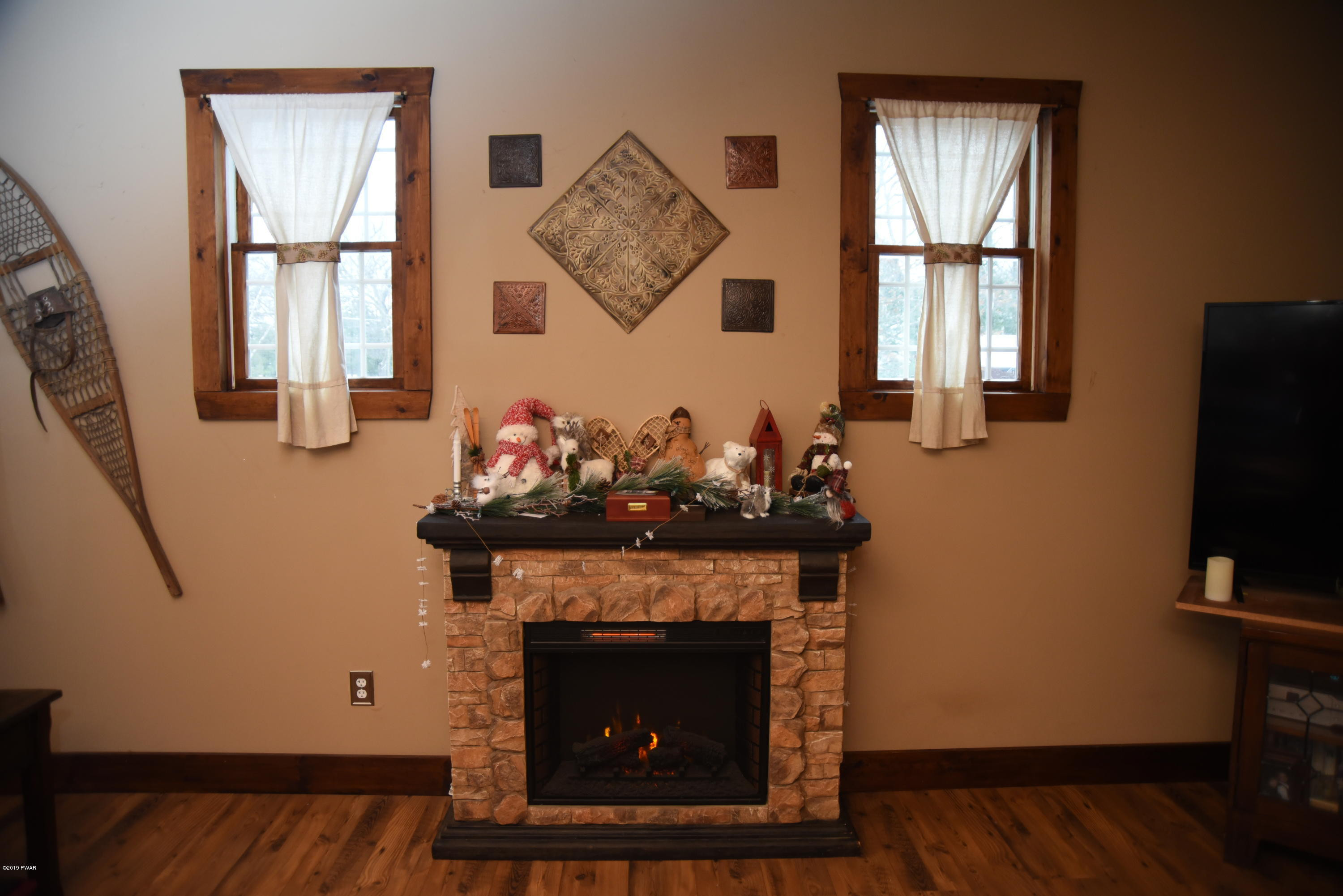 356 Springbrook Road Shohola, PA 18458 - Photo 16 of 53 Electric fireplace in family room