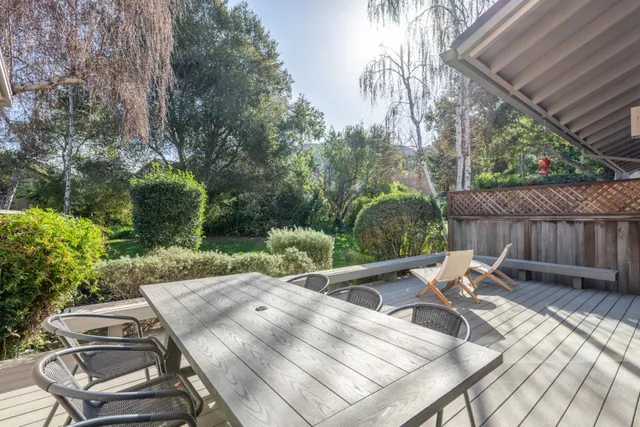 a view of backyard with seating space