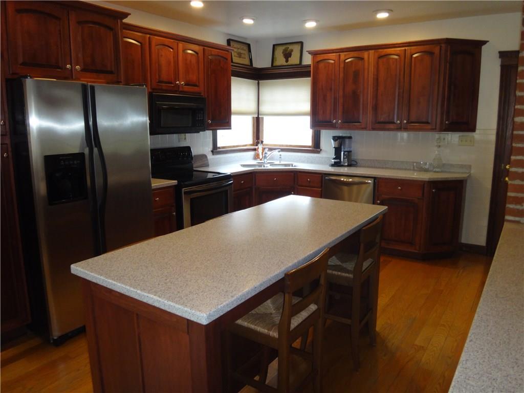 401 Bull Run Road Brownsville, PA 15417 - Photo 4 of 25 Updated kitchen with newer corian countertops and newer appliances. Kitchen island included.