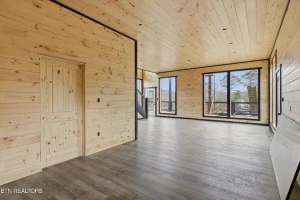 a view of balcony with wooden floor