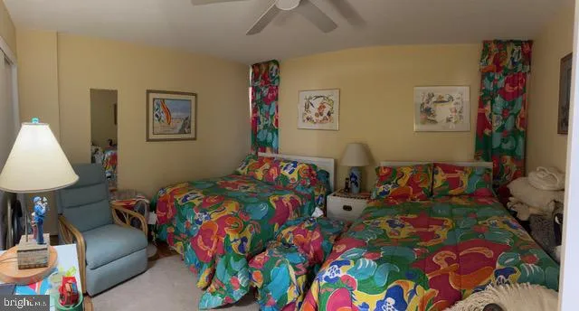 a bed room with furniture and a baby crib