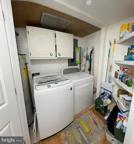 a view of storage and utility room with a washer and dryer