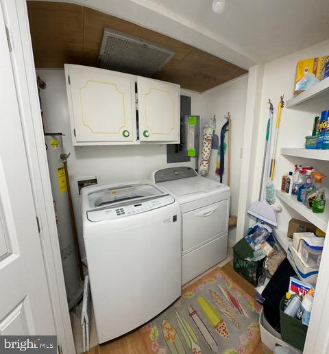 11604 Coastal Highway, Unit 1209 Ocean City, MD 21842 - Photo 16 of 20 a view of storage and utility room with a washer and dryer