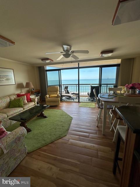 11604 Coastal Highway, Unit 1209 Ocean City, MD 21842 - Photo 8 of 20 a living room with furniture and a table