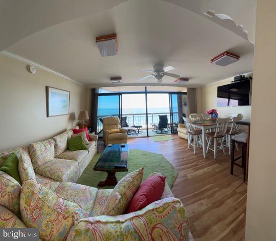 11604 Coastal Highway, Unit 1209 Ocean City, MD 21842 - Photo 9 of 20 a living room with furniture and a large window