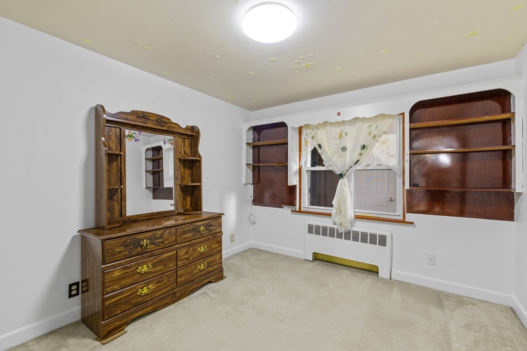 176 River Street Waltham, MA 02453 - Photo 14 of 32 a living room with furniture and flat screen tv