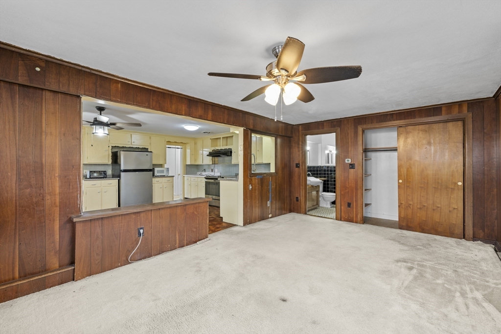 176 River Street Waltham, MA 02453 - Photo 16 of 32 a view of a kitchen with a sink and a refrigerator