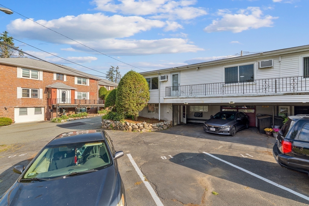 176 River Street Waltham, MA 02453 - Photo 28 of 32 a view of a cars park in front of a building