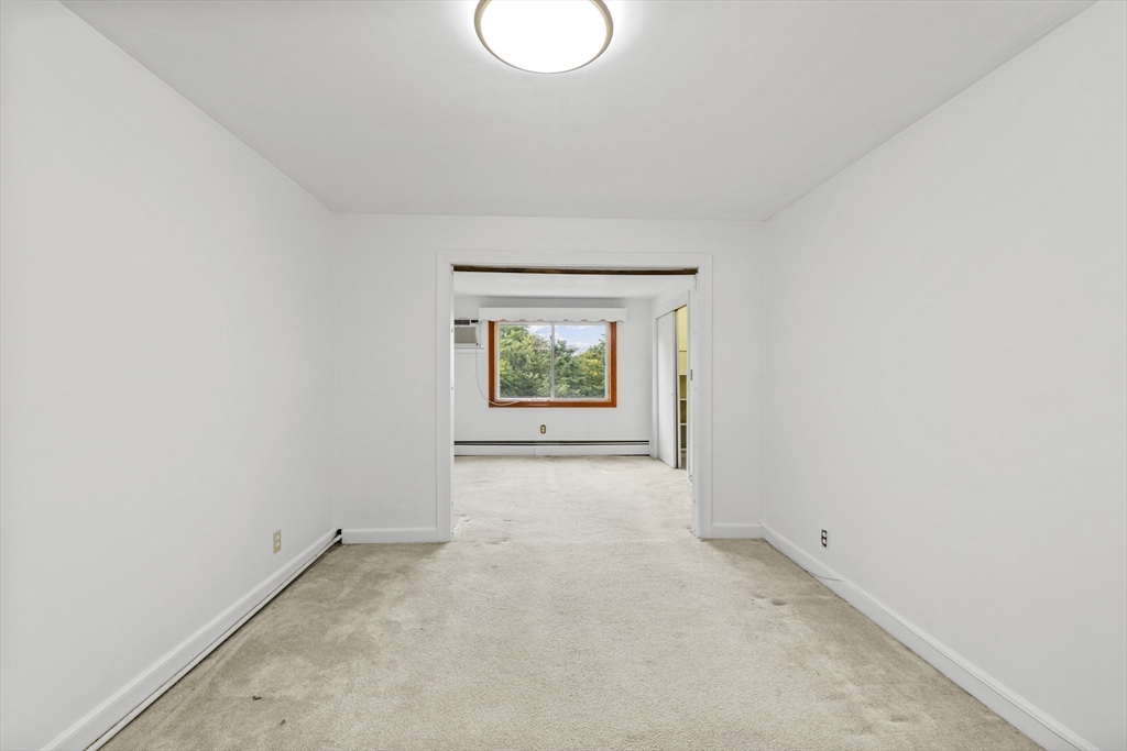 176 River Street Waltham, MA 02453 - Photo 10 of 32 an empty room with windows