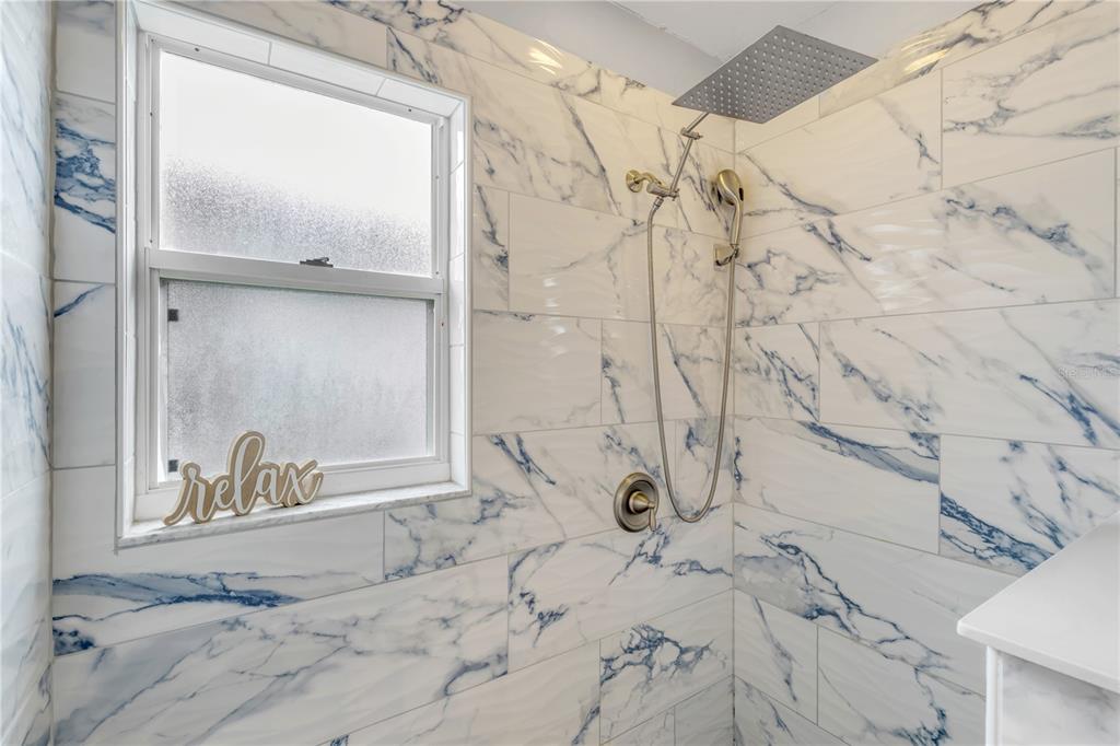 12232 Bronson Way Orlando, FL 32824 - Photo 15 of 32 a bathroom with shower bathtub