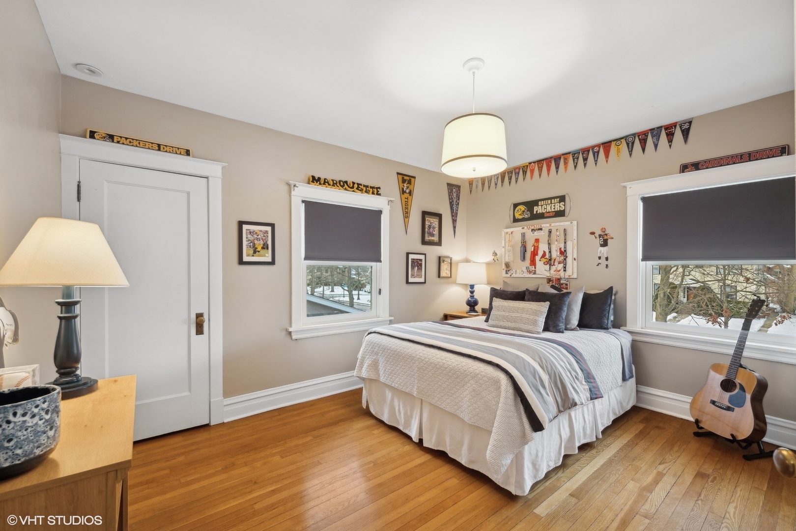 621 Maple Avenue Wilmette, IL 60091 - Photo 29 of 45 a spacious bedroom with a bed and a chandelier
