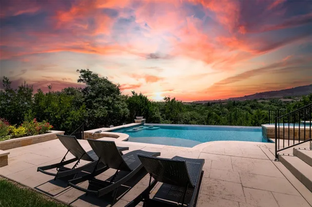 a view of a chairs and table on the terrace