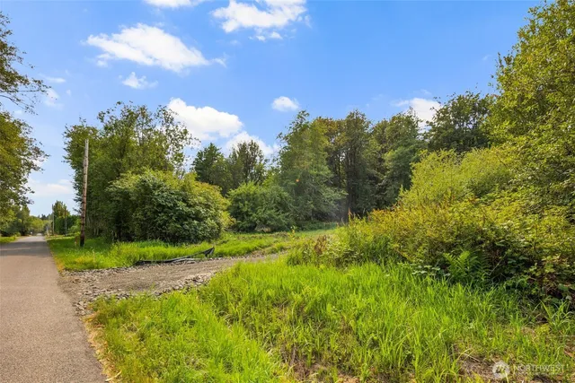 a view of a lake with a yard