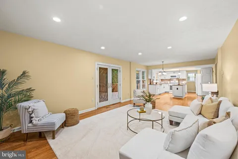 a view of a room that has a fan and a window