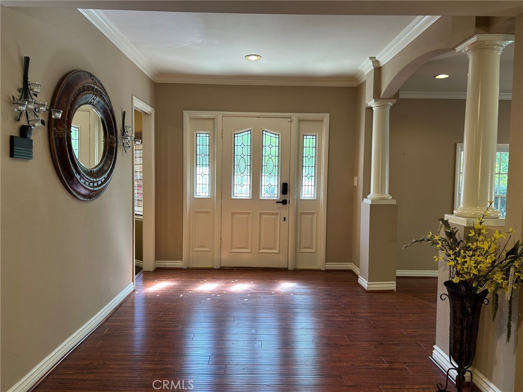 300 South Timken Road Anaheim, CA 92808 - Photo 7 of 40 a view of a hallway with wooden floor and a chair