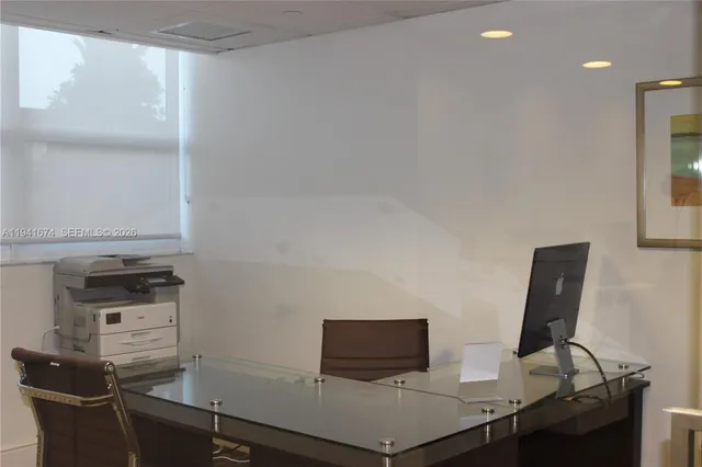 a view of a workspace with furniture